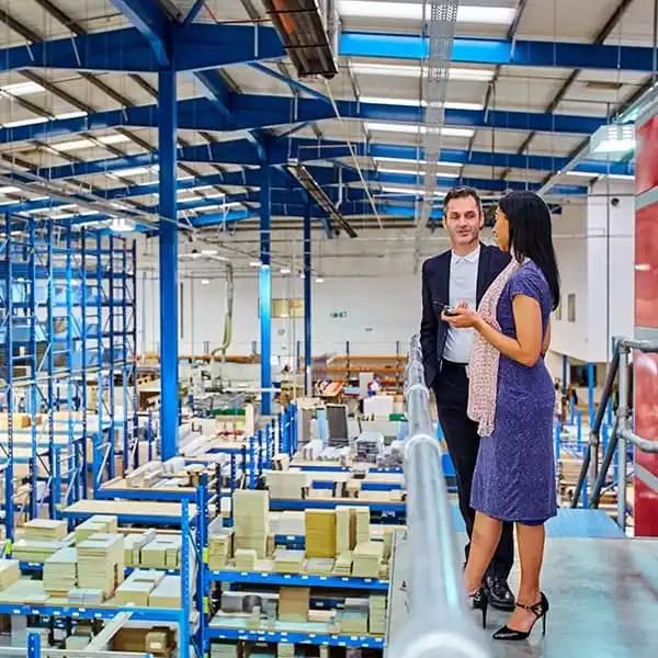 two people in a warehouse