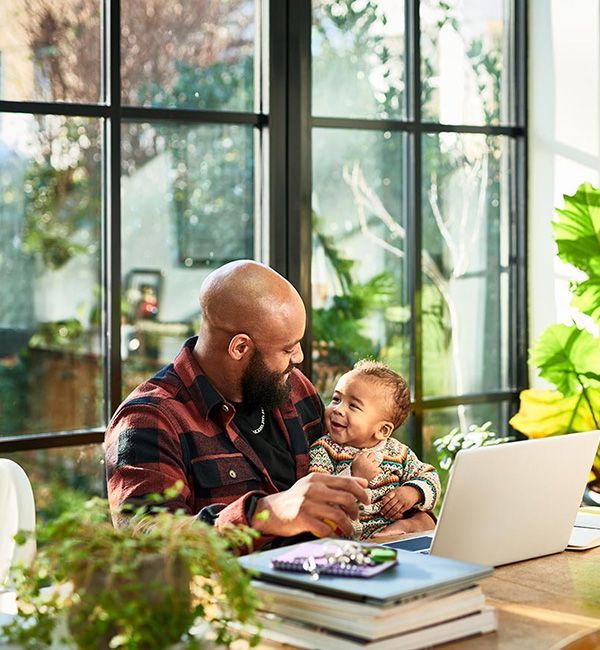 man with baby in home