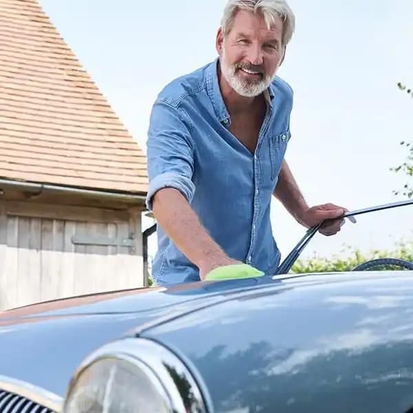 man with classic car